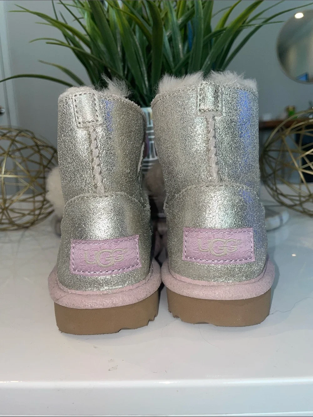 UGG Kids Glitter Boot with Pink Trim and Pom-Poms